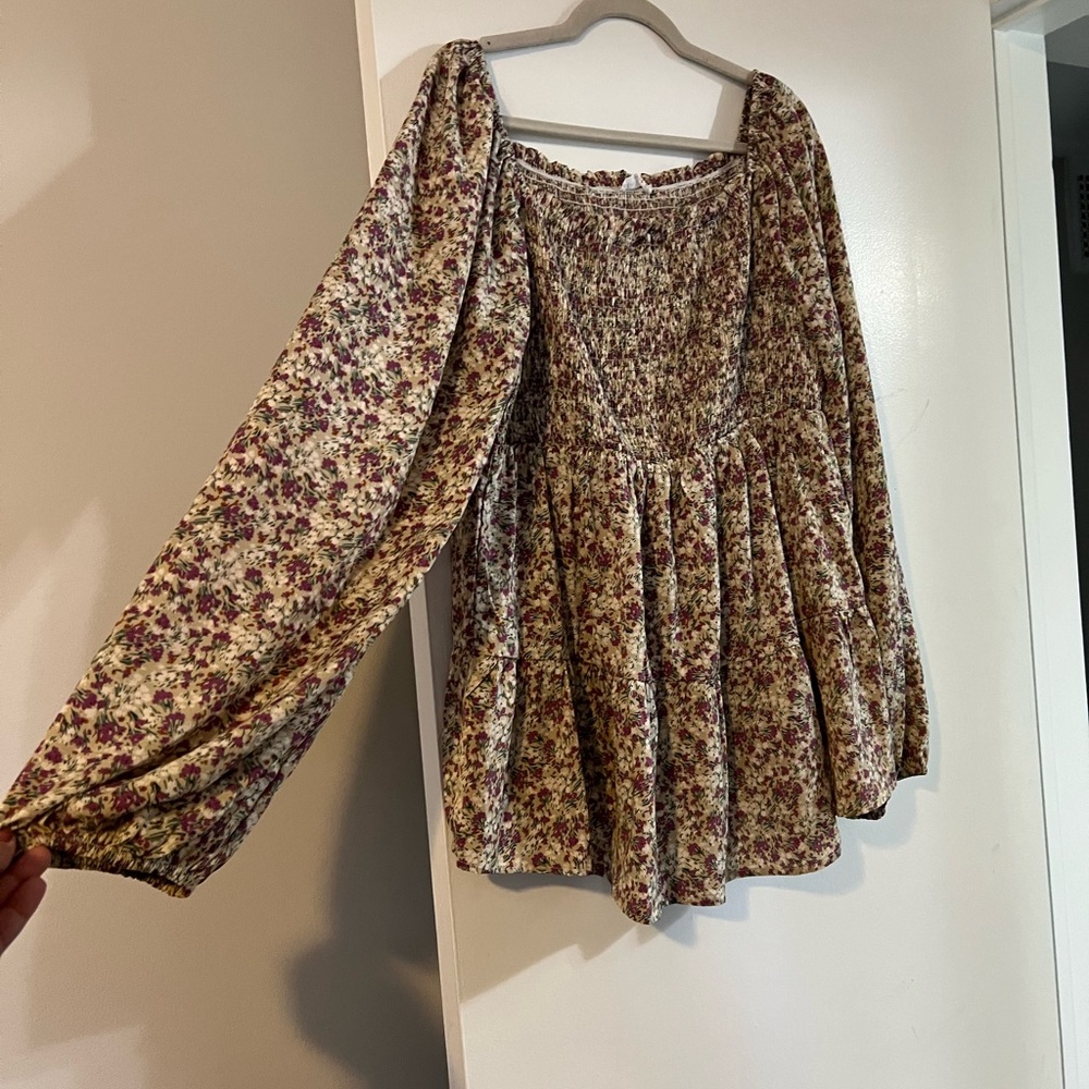 Tan and purple-ish colored long sleeve top with square neckline and stretch bust